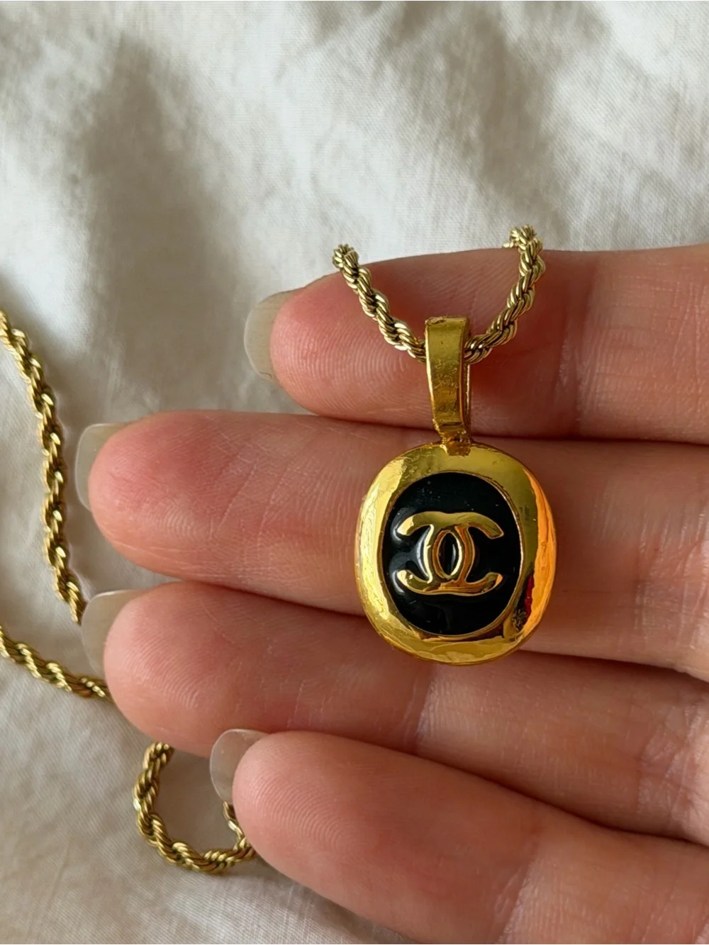 CHANEL Gold and Black Oval CC Pendant Necklace on Rope Chain
